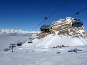 Grostè - 6er Hochgeschwindigkeits-Sesselbahn (kuppelbar) mit Abdeckhauben und Sitzheizung