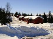 Blockhütten direkt an den Pisten