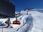 Sonnen Bahn (Gampabing) - 8er Hochgeschwindigkeits-Sesselbahn (kuppelbar) mit Abdeckhauben und Sitzheizung