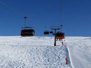 Campo-Lastè - 4er Hochgeschwindigkeits-Sesselbahn (kuppelbar) mit Abdeckhauben